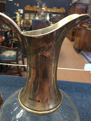Lot 436 - A SILVER COLLARED CLARET JUG AND STOPPER
