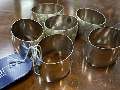 Lot 413 - A SET OF SIX EASTERN SILVER NAPKIN RINGS