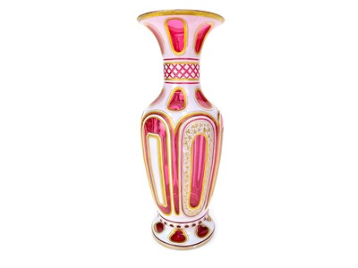 Lot 1007 - A LATE 19TH CENTURY BOHEMIAN CRANBERRY GLASS VASE