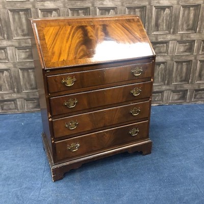 Lot 270 - A MAHOGANY REPRODUCTION BUREAU AND A MAHOGANY COFFEE TABLE AND TWO NESTS OF THREE TABLES