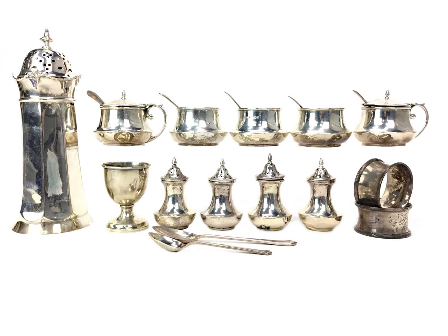 Lot 425 - A LOT OF SILVER CONDIMENT JARS, SHAKERS AND NAPKIN RINGS