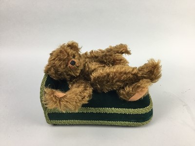 Lot 127 - A MERRYTHOUGHT BEAR AND A TOY DAY BED
