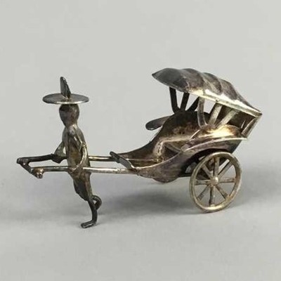 Lot 36 - A CHINESE SILVER MODEL OF A RICKSHAW DRIVER