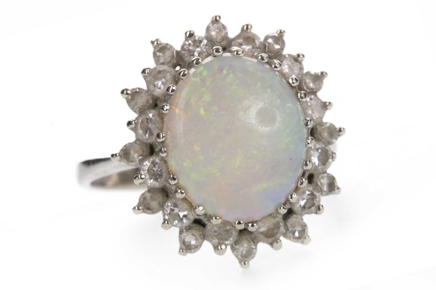 Lot 852 - AN OPAL AND DIAMOND RING