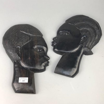 Lot 109 - A PAIR OF AFRICAN WALL MOUNTING HEADS ALONG WITH A BUST AND TWO BUDDHAS