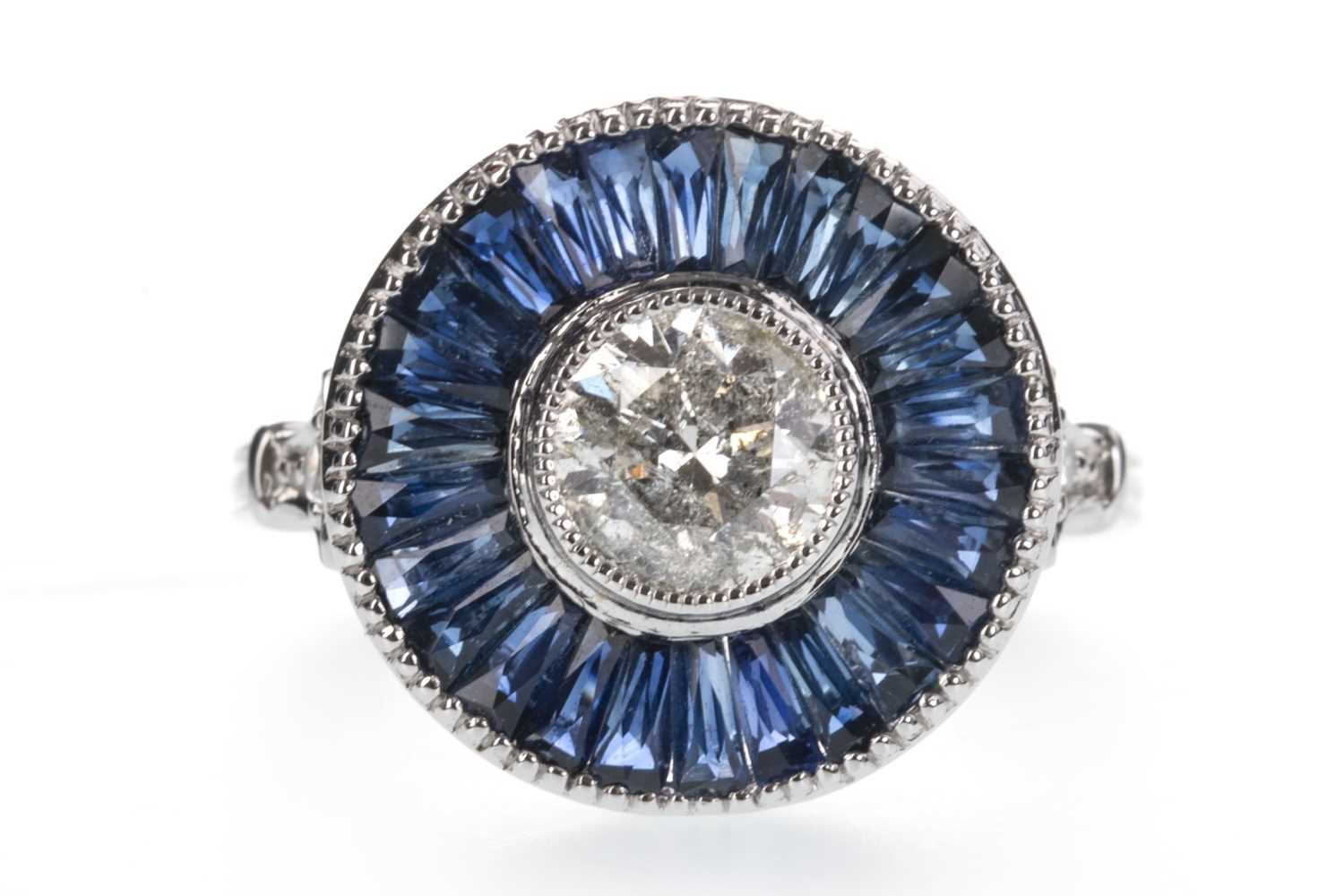 Lot 881 - A SAPPHIRE AND DIAMOND TARGET RING