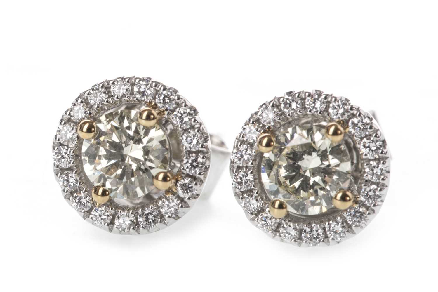 Lot 912 - A PAIR OF YELLOW AND WHITE DIAMOND EARRINGS