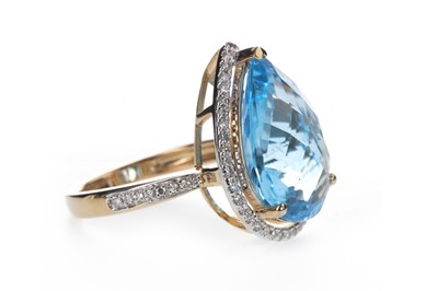 Lot 875 - A BLUE TOPAZ AND DIAMOND RING