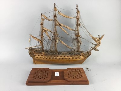Lot 292 - A WOOD MODEL OF A SHIP AND AN EXTENDING BOOK SLIDE