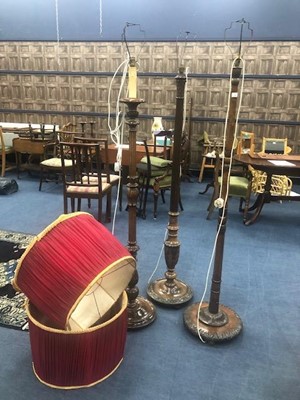 Lot 299 - A LOT OF THREE MAHOGANY CARVED WOOD STANDARD LAMPS