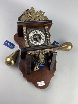 Lot 219 - A REPRODUCTION DUTCH STYLE WALL CLOCK