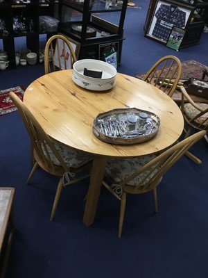 Lot 199 - A PINE CIRCULAR DINING TABLE AND FOUR CHAIRS