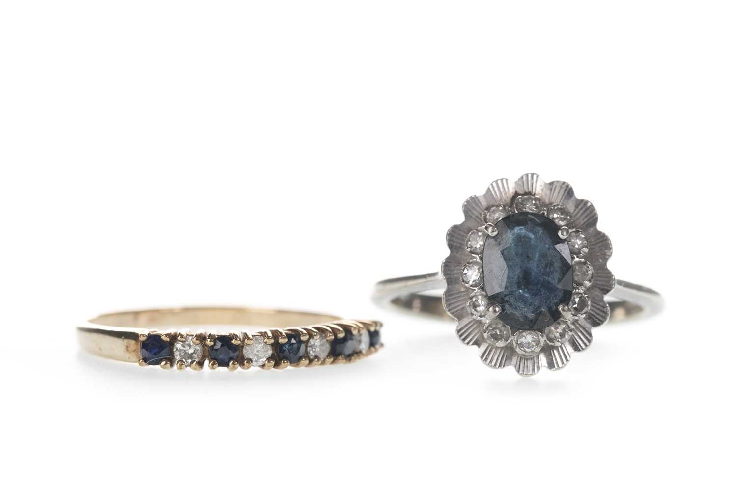 Lot 304 - A BLUE GEM SET AND DIAMOND RING AND A CLUSTER RING