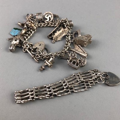 Lot 236 - A SILVER CHARM BRACELET AND A SILVER GATE BRACELET