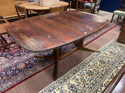 Lot 321 - A RETRO ROSEWOOD EXTENDING DINING TABLE
