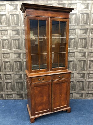 Lot 392 - A REPRODUCTION BURR WALNUT BOOKCASE ON CHEST