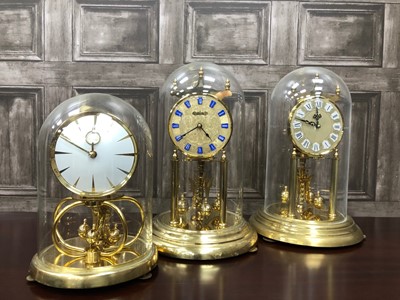 Lot 400 - A KUNDO ANNIVERSARY CLOCK WITH GLASS DOME AND TWO OTHERS