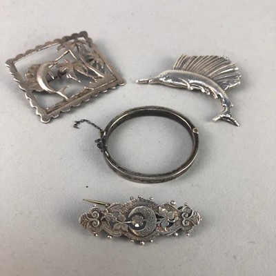 Lot 296 - A SILVER BANGLE AND THREE BROOCHES