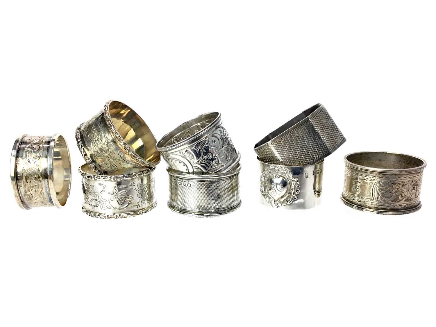 Lot 460 - A LOT OF EIGHT NAPKIN RINGS