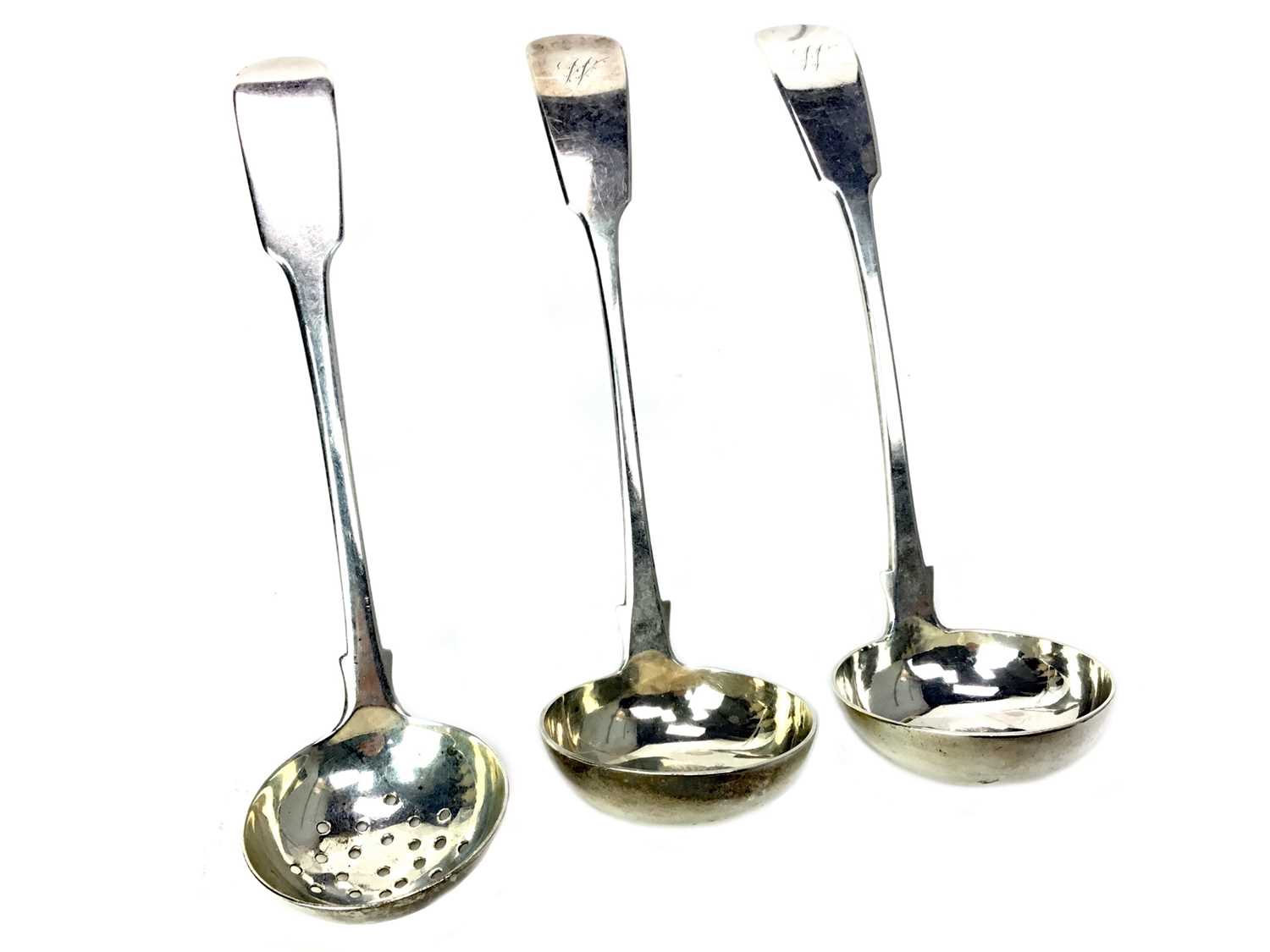 Lot 468 - A GEORGE IV SILVER TEA STRAINER ALONG WITH TWO SAUCE LADLES