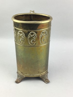 Lot 146 - A BRASS EMBOSSED FIRE COMPANION