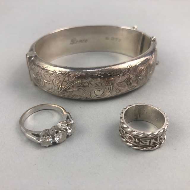 Lot 8 - A SILVER BANGLE, SILVER RING AND PASTE SET RING