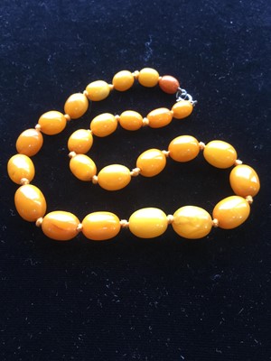 Lot 1306 - THREE BUTTERSCOTCH AMBER NECKLACES AND A RESIN BRACELET