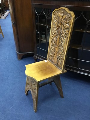 Lot 158 - A CARVED OAK HALL CHAIR