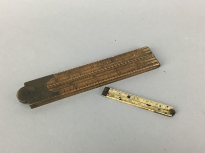 Lot 117 - A 19TH CENTURY IVORY FOLDING RULER AND A RULER