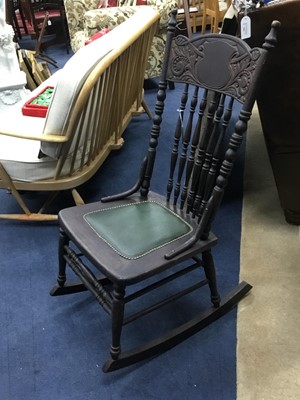 Lot 129 - A 19TH CENTURY CARVED WOOD ROCKING CHAIR