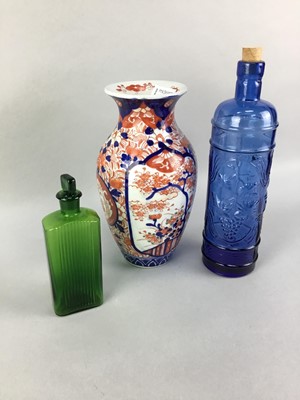 Lot 278 - A JAPANESE IMARI VASE, TWO GLASS BOTTLES AND A PAIR OF CANDLESTICKS
