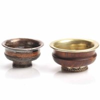 Lot 904 - TWO TIBETAN SILVER AND METAL MOUNTED BOWLS in...