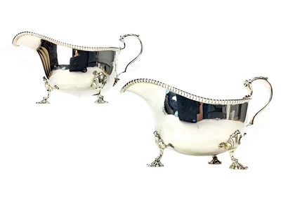 Lot 535 - A PAIR OF EARLY 20TH CENTURY SILVER SAUCEBOATS