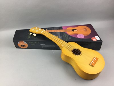 Lot 365 - A UKULELE SET