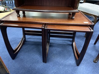 Lot 411 - A NEST OF TABLES AND A BOOKCASE