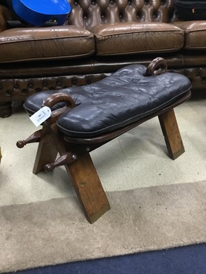 Lot 391 - A CAMEL STOOL WITH PADDED SEAT