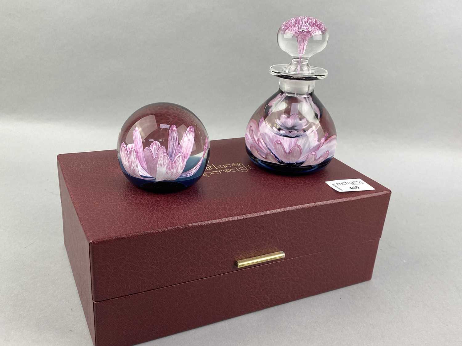 Lot 469 - A CAITHNESS 'LILAC TIME' BOTTLE WITH STOPPER AND PAPERWEIGHT SET