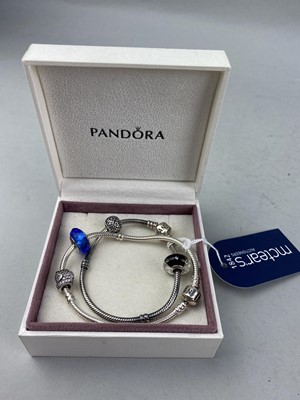 Lot 544 - A LOT OF TWO SILVER PANDORA BRACELETS