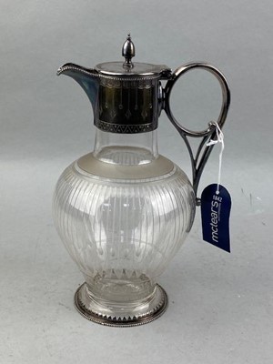 Lot 553 - A CLARET JUG IN THE STYLE OF CHRISTOPHER DRESSER