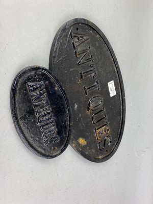 Lot 555 - A LOT OF TWO CAST IRON 'ANTIQUES' SIGNS