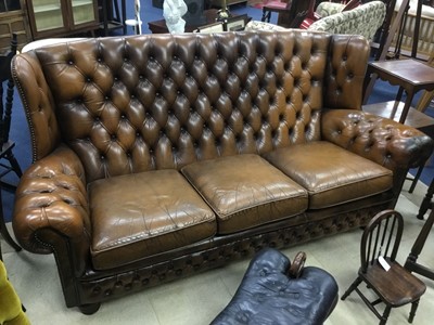 Lot 447 - A BROWN LEATHER WING BACK SETTEE