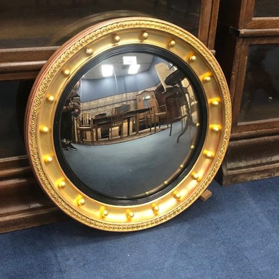 Lot 434 - A CONVEX CIRCULAR WALL MIRROR