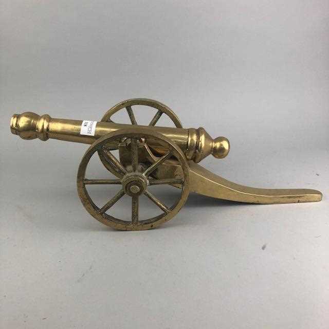 Lot 118 - A BRASS MODEL OF A CANNON