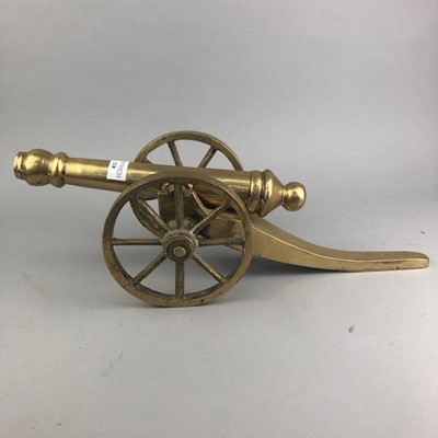 Lot 118 - A BRASS MODEL OF A CANNON