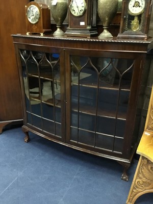 Lot 168 - A MAHOGANY BOW FRONTED TWO DOOR BOOKCASE