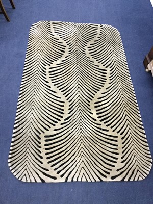 Lot 293 - A SET OF TWO ZEBRA SKIN PATTERN RUGS