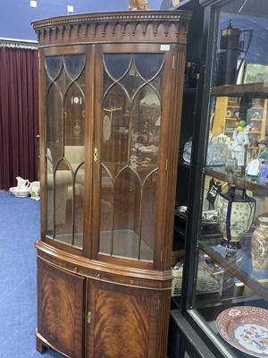 Lot 263 - A REPRODUCTION MAHOGANY BOW FRONTED CORNER CABINET AND ANOTHER