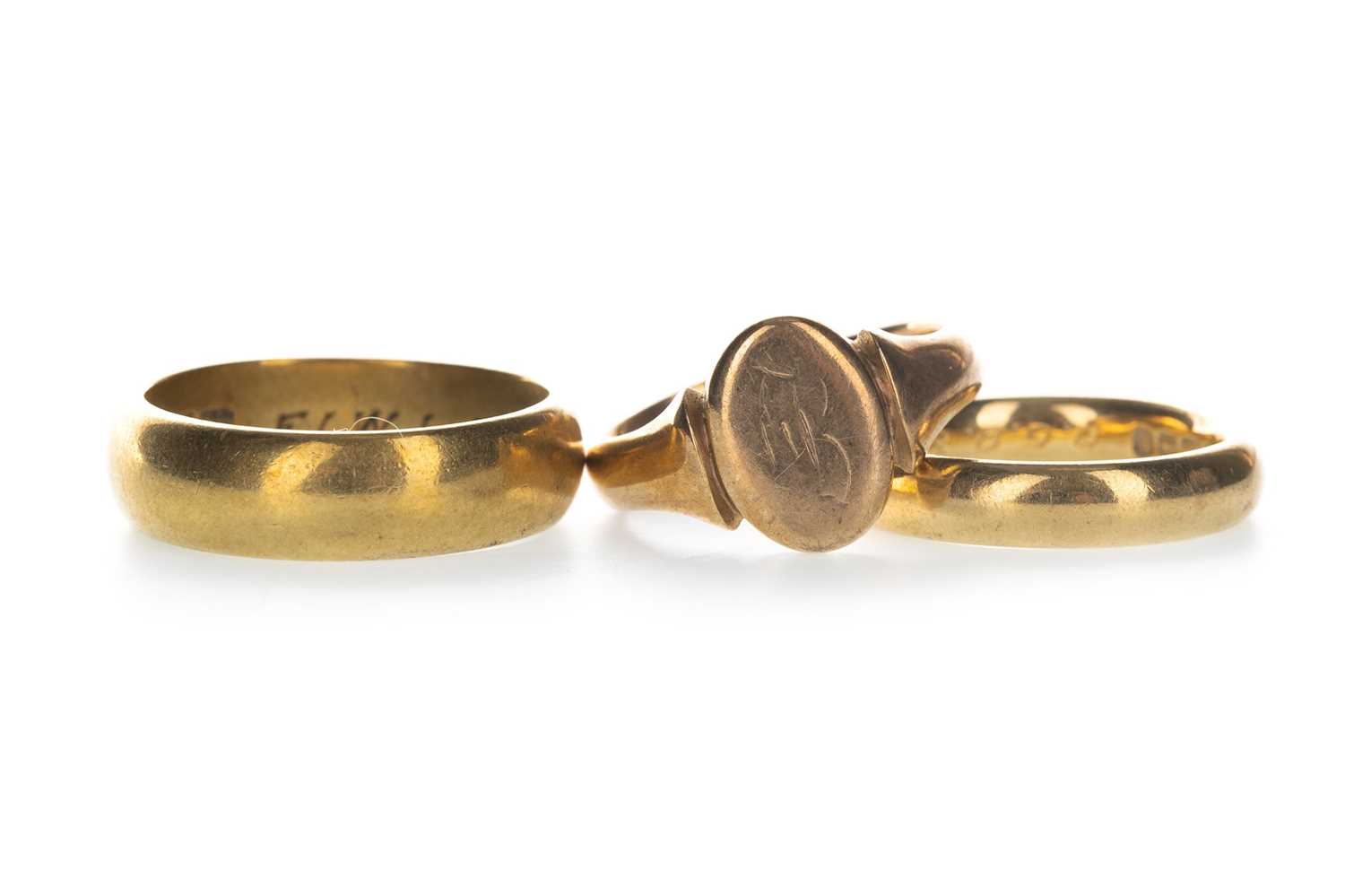 Lot 1303 - TWO GOLD WEDDING BANDS AND A SIGNET RING