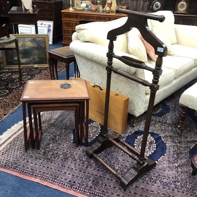 Lot 102 - A MAHOGANY VALET STAND AND A NEST OF TABLES