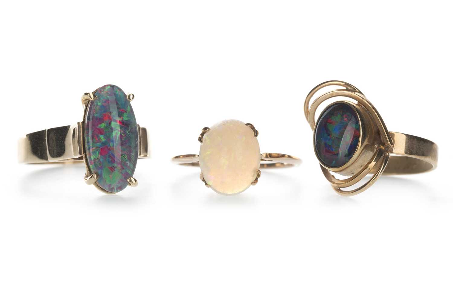 Lot 1316 - AN OPAL RING AND TWO OPAL DOUBLET RINGS